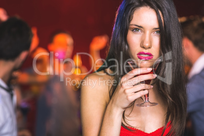 Drunk brunette looking at camera