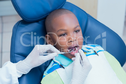 Close up of boy having his teeth examined