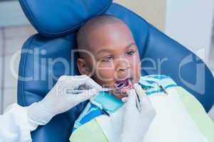 Close up of boy having his teeth examined