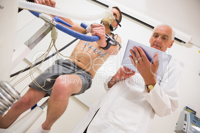 Man doing fitness test on exercise bike