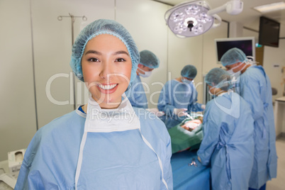 Medical students practicing surgery on model