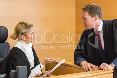 Lawyer speaking with the judge