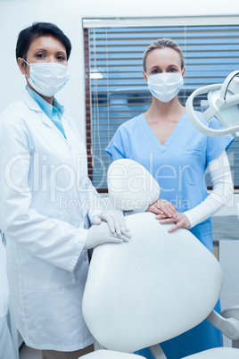 Female dentists wearing surgical masks