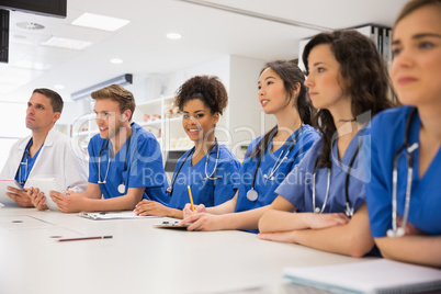 Medical student smiling at the camera during class