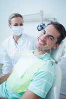 Smiling young man waiting for dental exam
