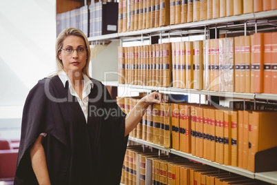 Portrait of a serious lawyer with reading glasses