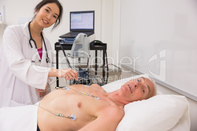 Medical student practicing on older man