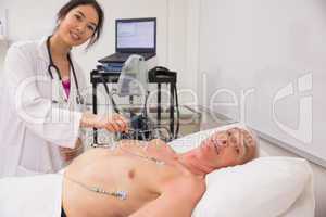 Medical student practicing on older man