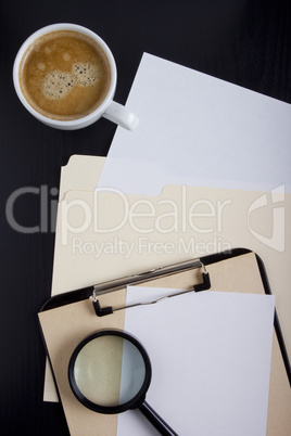 Folder and a magnifying glass
