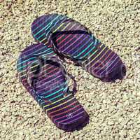 Flip-flops on stony beach