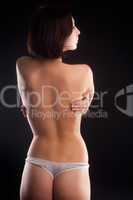 Beautiful topless woman. Back view