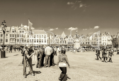 BRUGES, BELGIUM - MAY 15, 2012: Tourists enjoy city life on a be