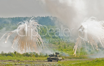 Russian tank T-80 making smoke screen from enemy