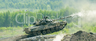 Shooting tank T-80 jumping in motion