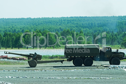 army truck transports a gun