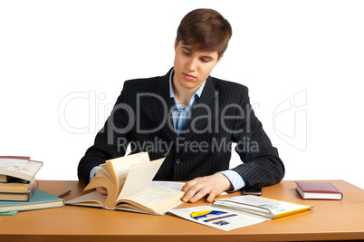 cute man reading book at table