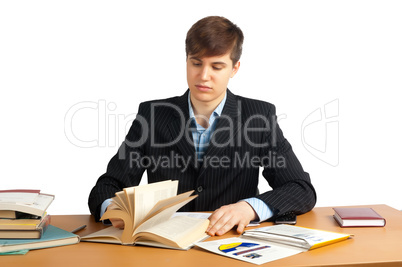 cute man reading book at table