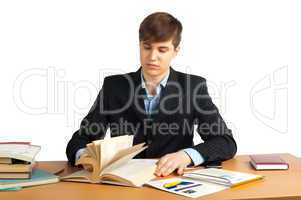 cute man reading book at table