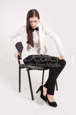 Angry business woman on chair