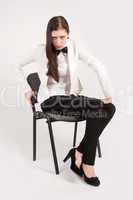 Angry business woman on chair