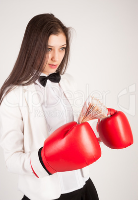 young businesswoman in boxing gloves