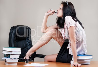 Attractive business woman on table