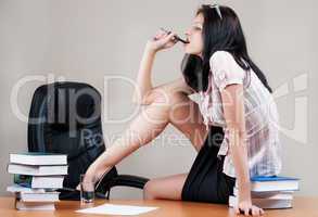 Attractive business woman on table