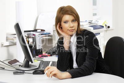 Pretty businesswoman in office