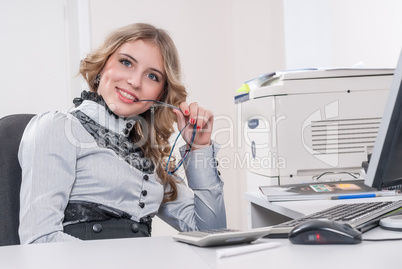 Young attractive businesswoman in office