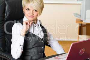 Attractive businesswoman with laptop