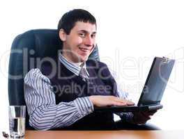 Portrait of a young businessman with laptop