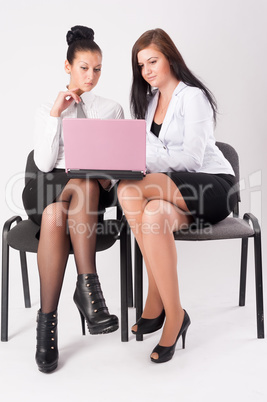 Two women work in team