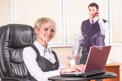 Pretty business lady with laptop