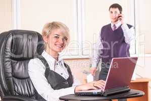 Pretty business lady with laptop