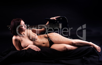 Beautiful sexy woman with guitar