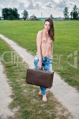 Attractive topless woman with suitcase