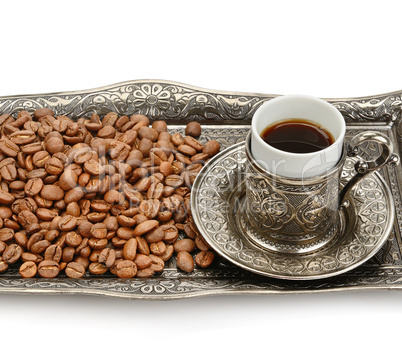Turkish cup and coffee grain isolated on white background