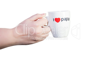 Hand und Kaffeetasse