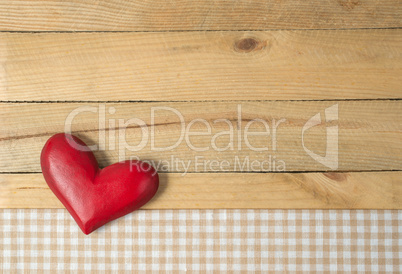 Red Heart on wooden background