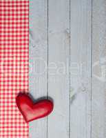 Red Heart on wooden background