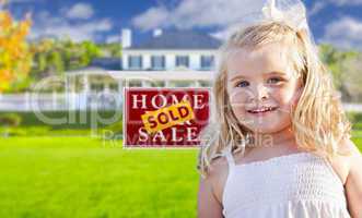 Girl in Yard with Sold Real Estate Sign and House