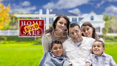 Hispanic Family in Front of Sold Real Estate Sign, House