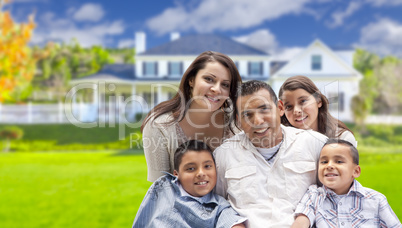 Young Hispanic Family in Front of Their New Home