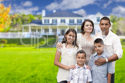 Young Hispanic Family in Front of Their New Home