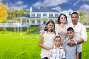 Young Hispanic Family in Front of Their New Home