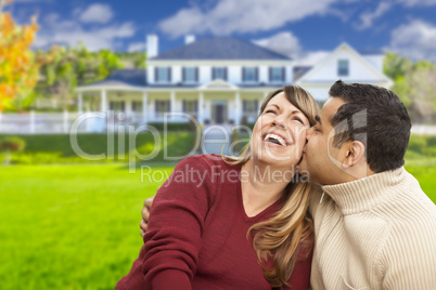 Happy Mixed Race Couple in Front of House