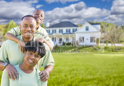 African American Family In Front of Beautiful House