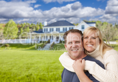 Happy Caucasian Couple Hugging In Front of House