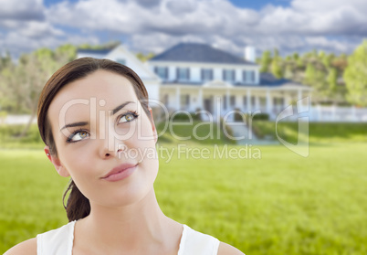 Thoughtful Mixed Race Woman In Front of House