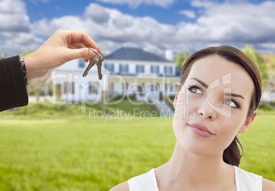 Agent Handing Mixed Race Woman Keys In Front of House